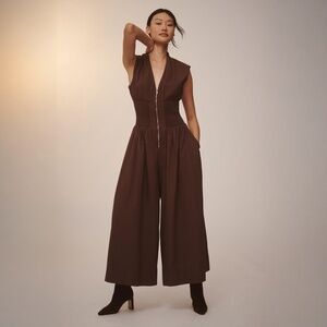 Anthropologie’s The Tommie Cap-Sleeve front Zipper smocked Jumpsuit  WINE color